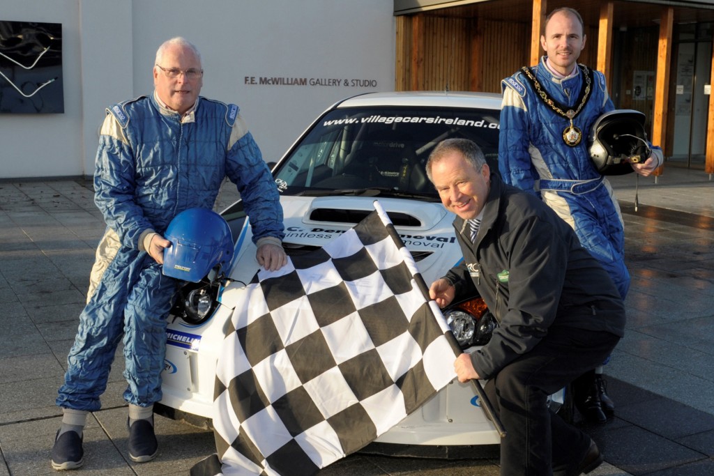 Lord Mayor of Armagh City, Banbridge and Craigavon, Cllr Darryn Causby (back, right) helps launch the Circuit of Ireland Rally in Banbridge with Event Director, Bobby Willis (front, left) and local rally driver Kenny McKinstry (right).
