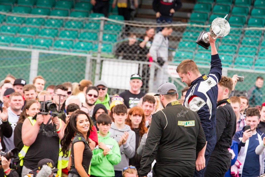 Duane McKeever lifts his winners trophy with Tomas Kiely and Jack Shanahan finishing off the rostrum 