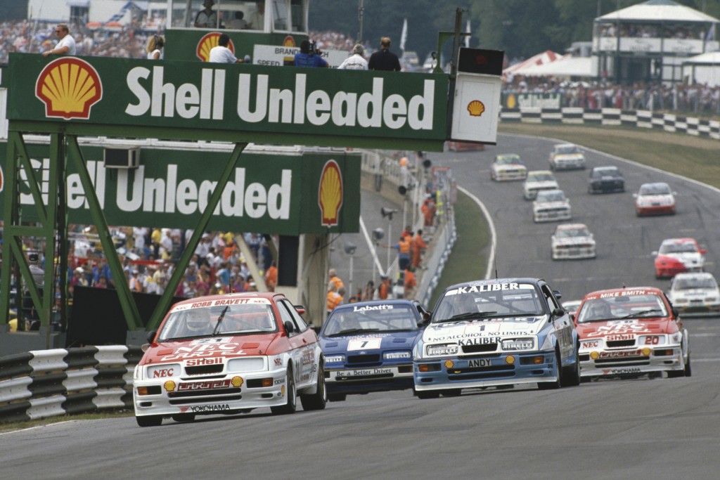 1989 British Touring Car Championship. Brands Hatch, England. 23rd July 1989. Rd 8. Robb Gravett (Ford Sierra RS500),1st position, leads Andy Rouse (Ford Sierra RS500), 2nd position and Mike Smith (Ford Sierra RS500), 3rd position, at the start of the race, action.  World Copyright: LAT Photographic. Ref:  89BTCC BH04