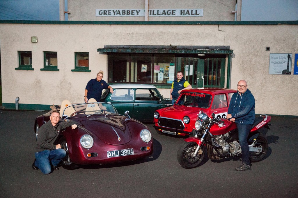 An array of vehicles on display at Greyabbey Village Hall at the launch of this year's Classic Bike & Car Show, set to he held at the venue on Saturday 24 August. Pictured L-R: Kenny Crossan; Joanne Andrews; Lewis Dunlop; Paul Taggart.