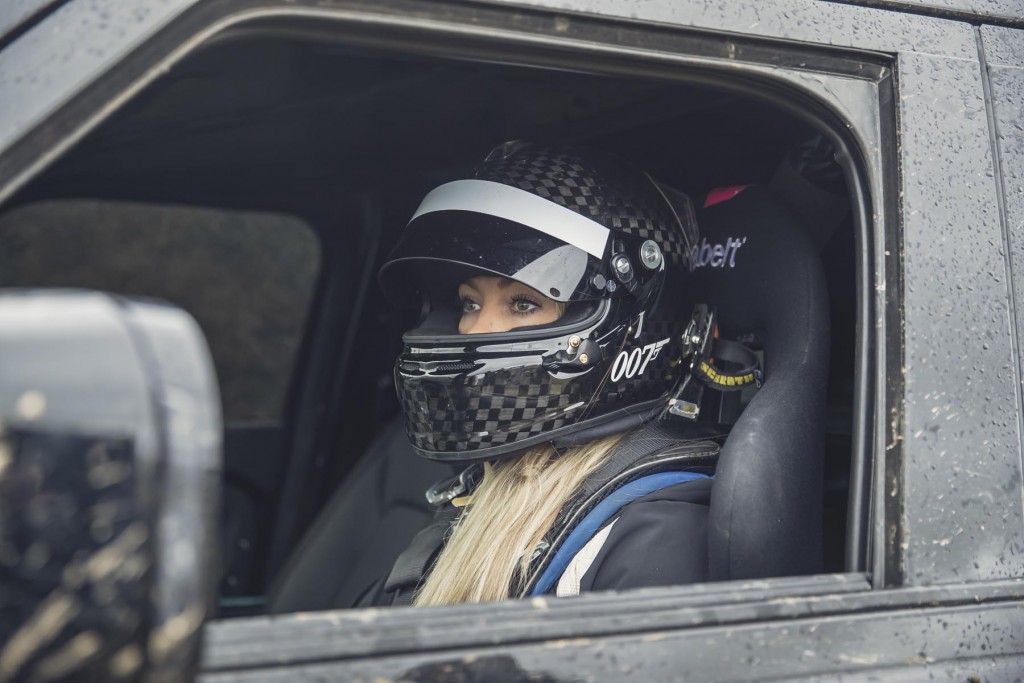 Behind the scenes image of Stunt Driver Jessica Hawkins with the New Defender featured in No Time To Die _04